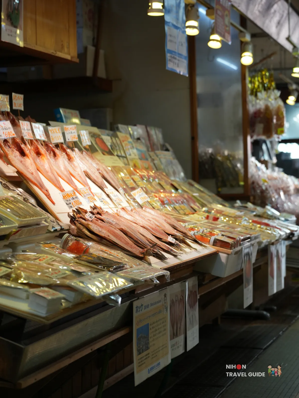 Counter filled with rows of dried fish and packaged seafood at Hakodate Morning Market.