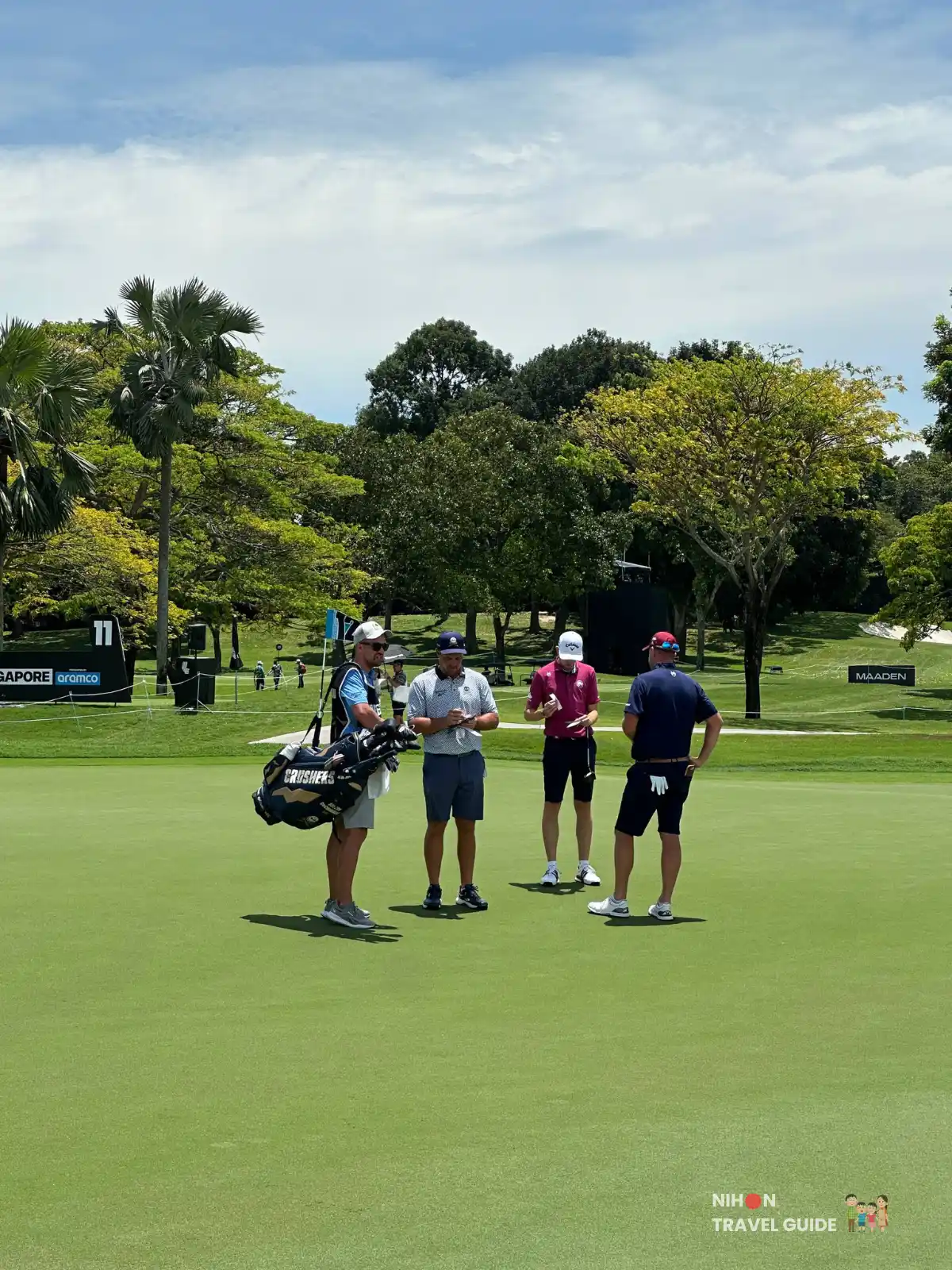 Bryson DeChambeau, Tom McKibbin & Marc Leishman signing each other's scorecards.