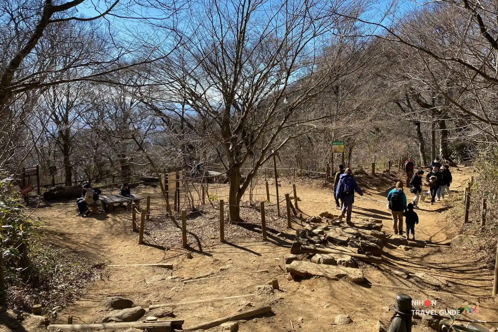 A small rest area with wooden benches along the trail between Nantaisan Peak and the Miyukigahara Summit Village on Mount Tsukuba.