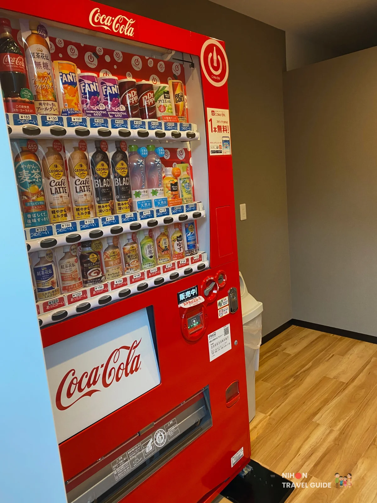 Red Coca-Cola vending machine with assorted soft drinks and coffees inside Hotel R9 The Yard Tsukuba.