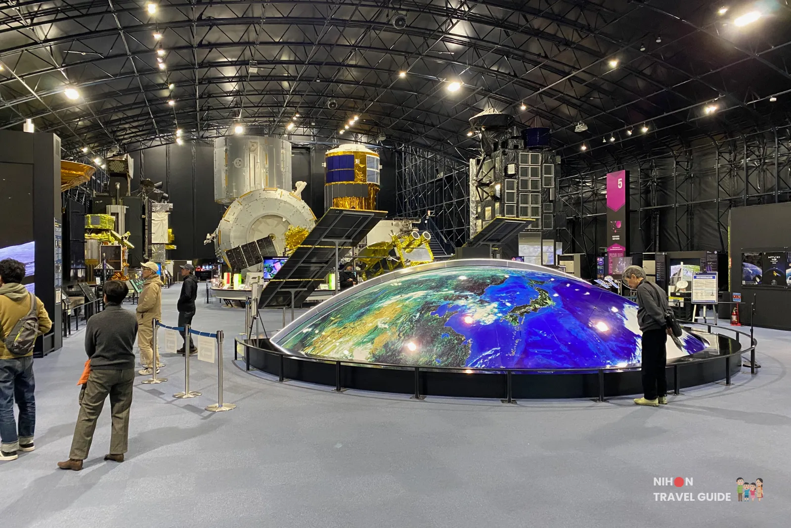 jaxa-tsukuba-dream-port-earth-model-space-dome JAXA’s 1:1,000,000 scale ‘Dream Port’ Earth model surrounded by satellite exhibits inside the Space Dome at Tsukuba Space Center.