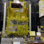 Full-scale model of JAXA’s GOSAT ‘Ibuki’ greenhouse-gas observing satellite wrapped in gold thermal foil on display inside the Space Dome at Tsukuba Space Center.