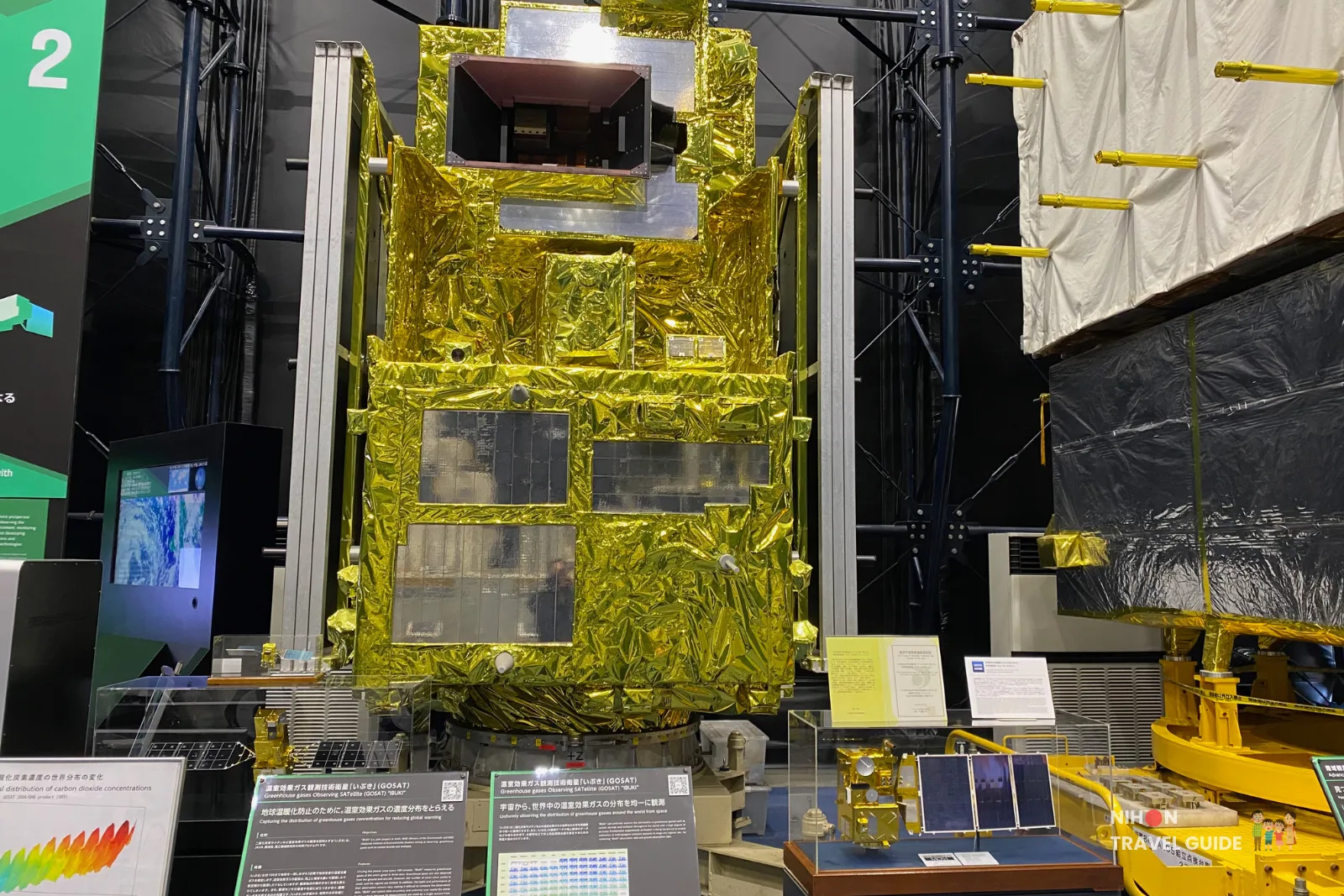 Full-scale model of JAXA’s GOSAT ‘Ibuki’ greenhouse-gas observing satellite wrapped in gold thermal foil on display inside the Space Dome at Tsukuba Space Center.
