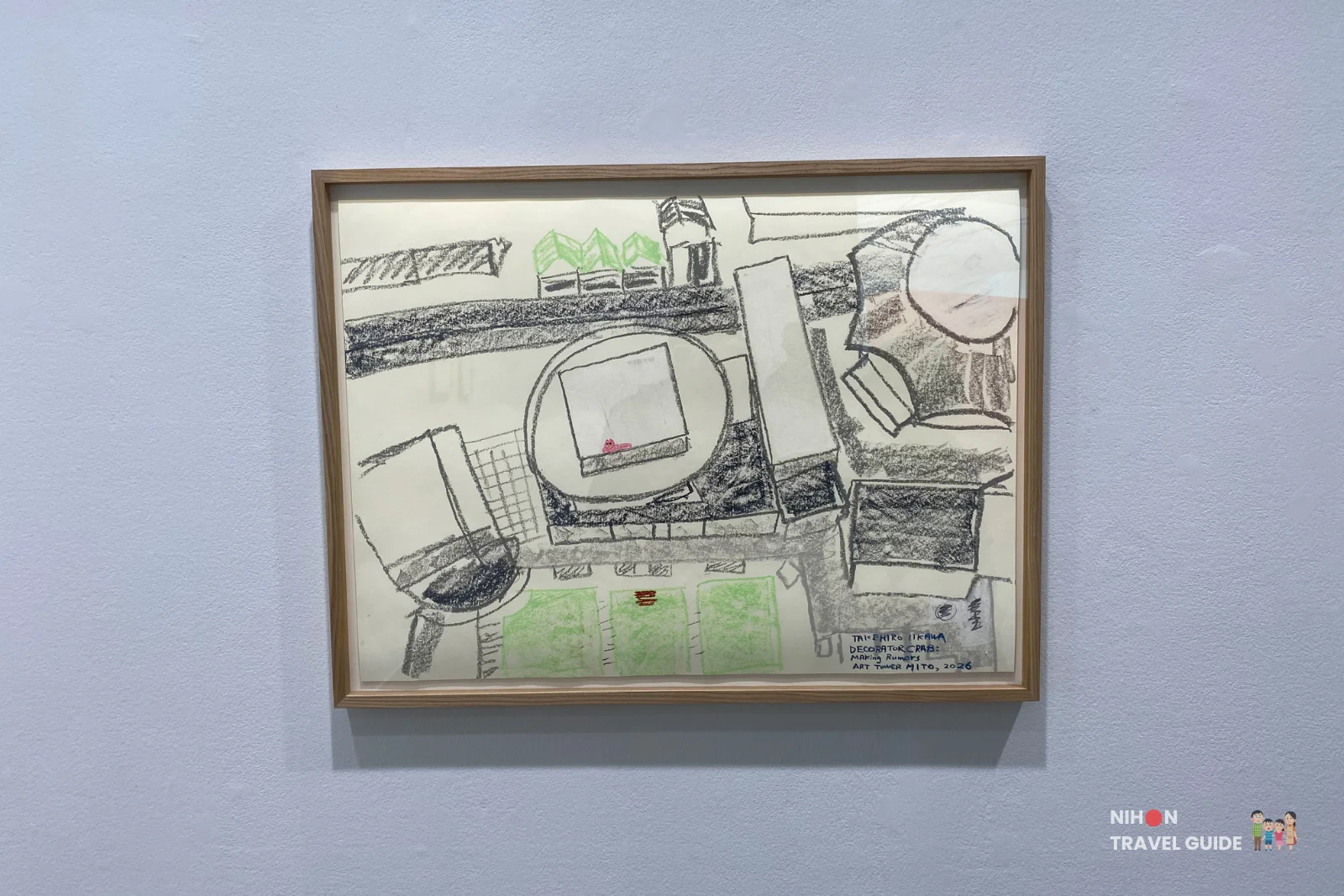 Small framed drawing of two figures in a boxing pose by Takehiro Iikawa, part of the “Decorator Crab — Make Space, Use Space” exhibition at Art Tower Mito.