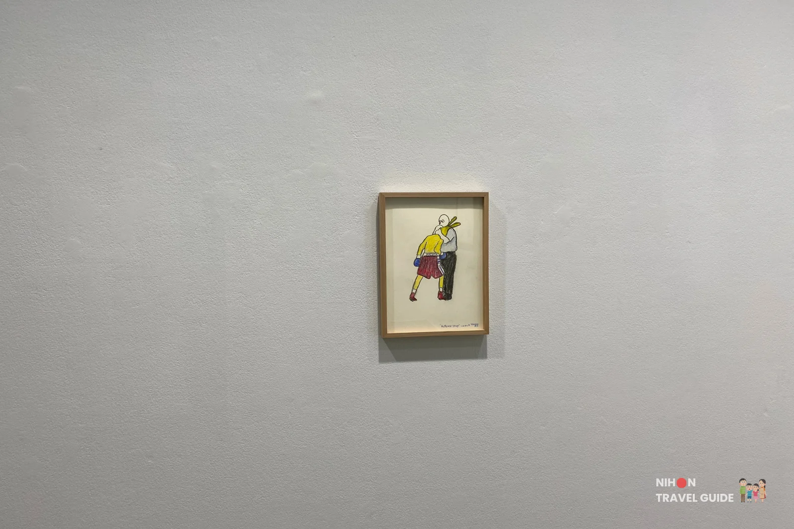 Small framed drawing titled “Rabbit Step” by Takehiro Iikawa showing two figures in boxing gloves, part of the “Gathering Matters and Mediations” exhibition at Art Tower Mito.