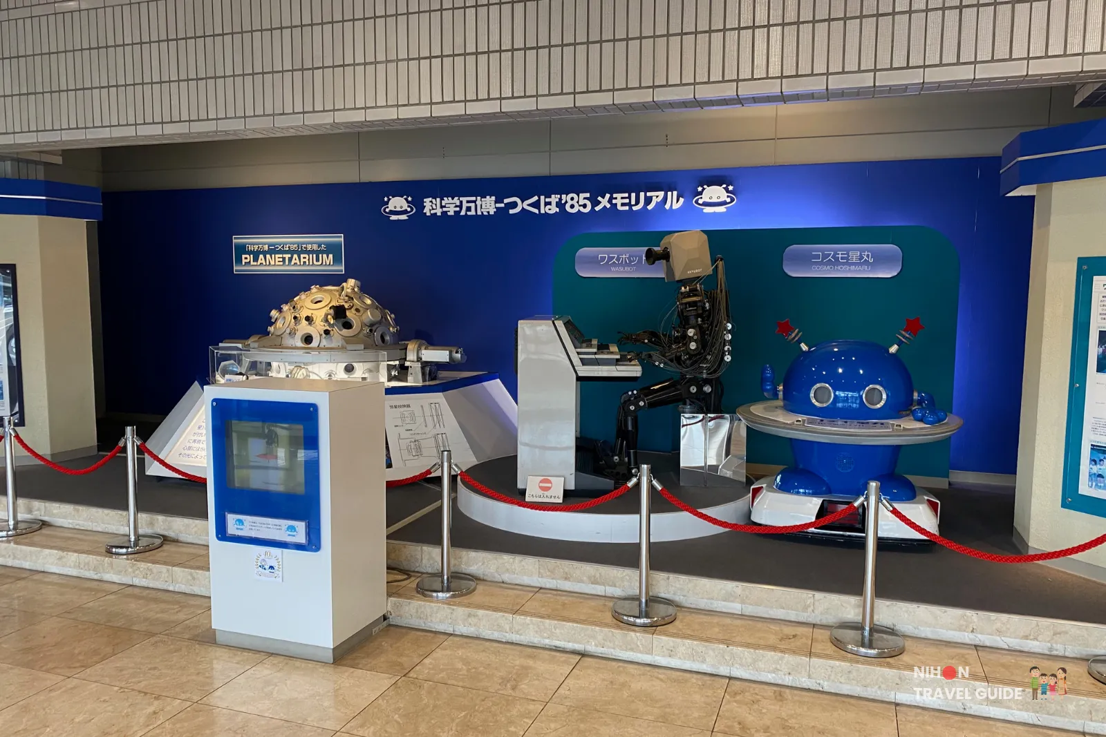 Display featuring the famous WABOT piano-playing robot and the blue version of the mascot Cosmo Hoshimaru in the Tsukuba Expo '85 Memorial area.