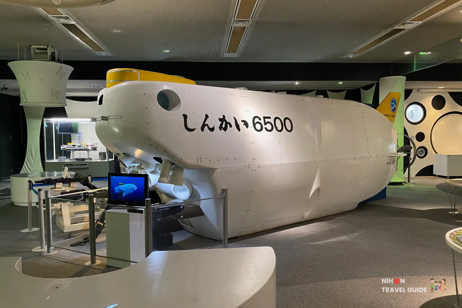 Large-scale model of the Shinkai 6500 deep-sea research submersible on the second floor of Tsukuba Expo Center. The impressive white vessel is one of the highlights of the deep-sea exploration zone.