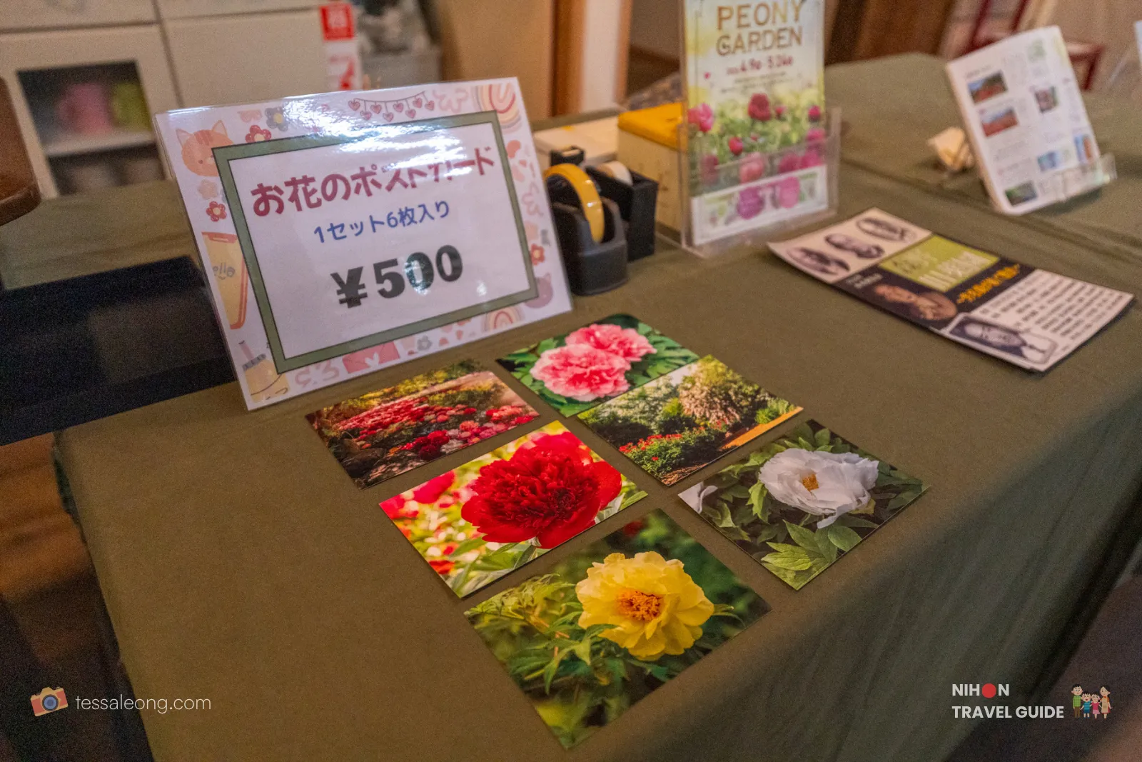 Peony-themed postcards for sale at the Garden Shop in Peony Garden Tokyo. Sets of 6 beautiful flower postcards priced at ¥500, displayed on a table with peony photos.