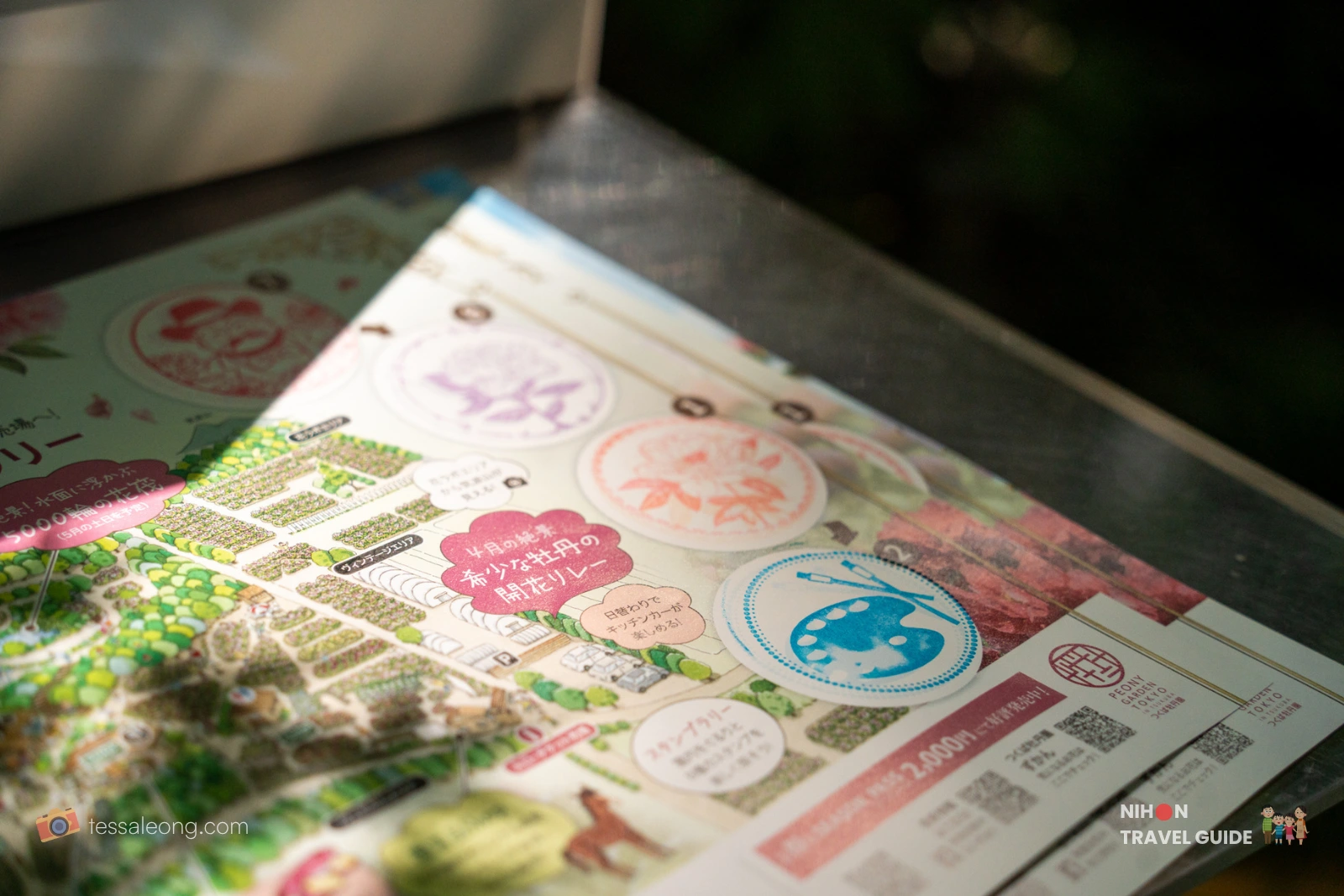 Close-up of the Peony Garden Tokyo stamp rally map showing multiple stamped circles, garden layout, and illustrations for the different stations and attractions.