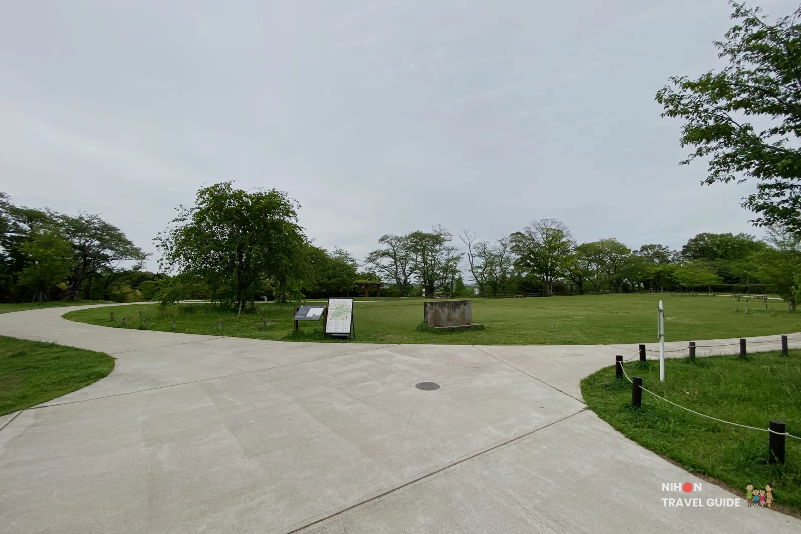 Open grassy area and pathways on Sakura Hill at Akebonoyama Agricultural Park.