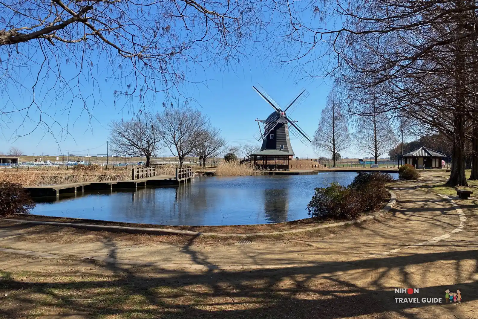 Dutch windmill reflected in the pond during winter at Akebonoyama Agricultural Park