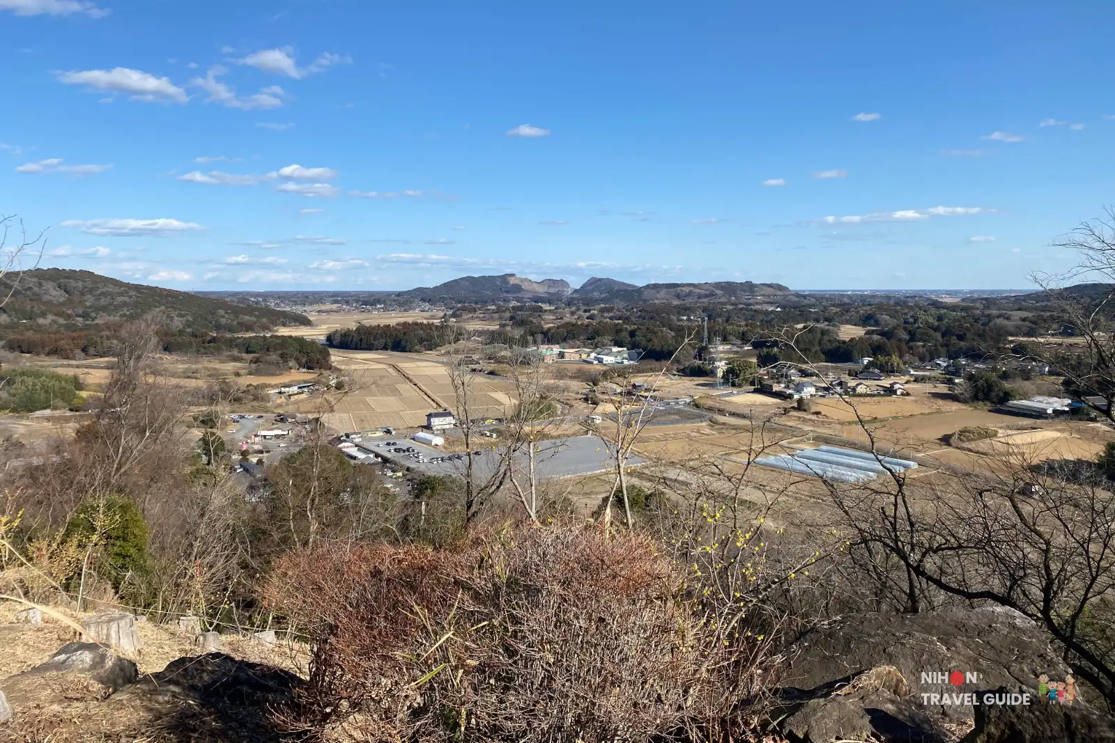 Panoramic winter view from Hanayasatoyama Hill at Ibaraki Flower Park overlooking the countryside and mountains.