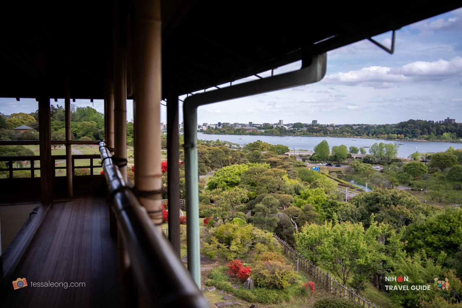 Sweeping panoramic view from Rakujuro on the top floor of Kobuntei, showing Kairakuen Garden, Lake Senba, and distant cityscape