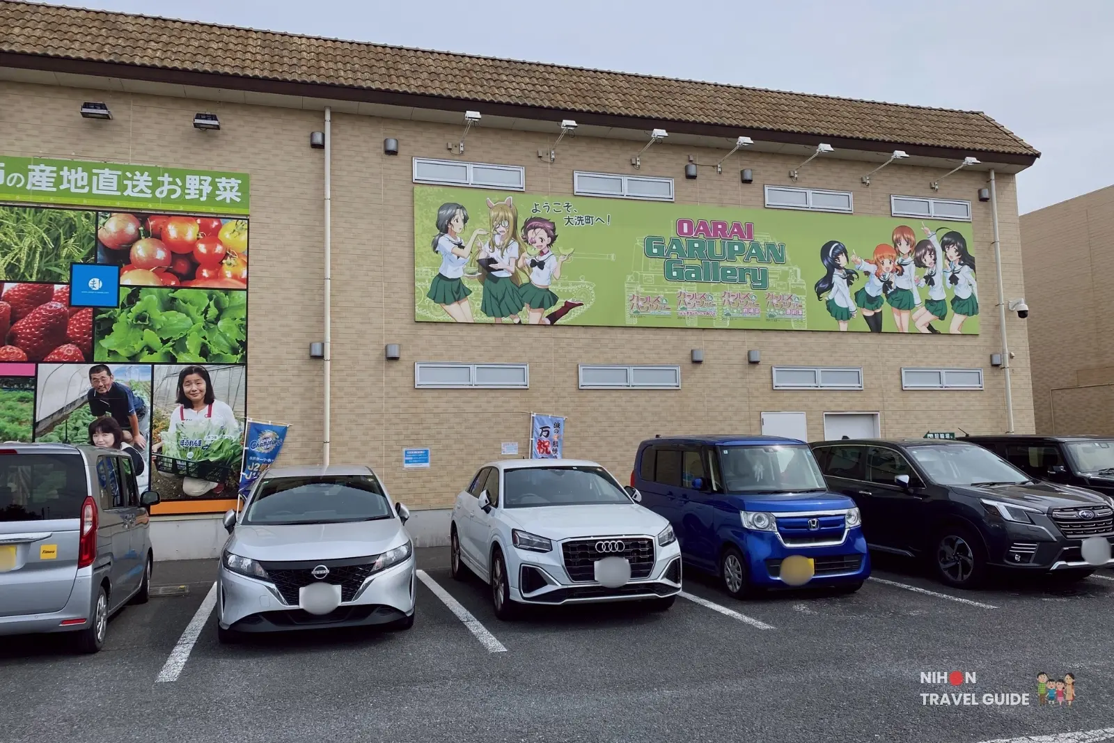 oarai-garupan-gallery-large-banner-exterior-seaside-station Large Girls und Panzer banner on the building at Oarai Seaside Station and Maiwai Market in Ibaraki Japan