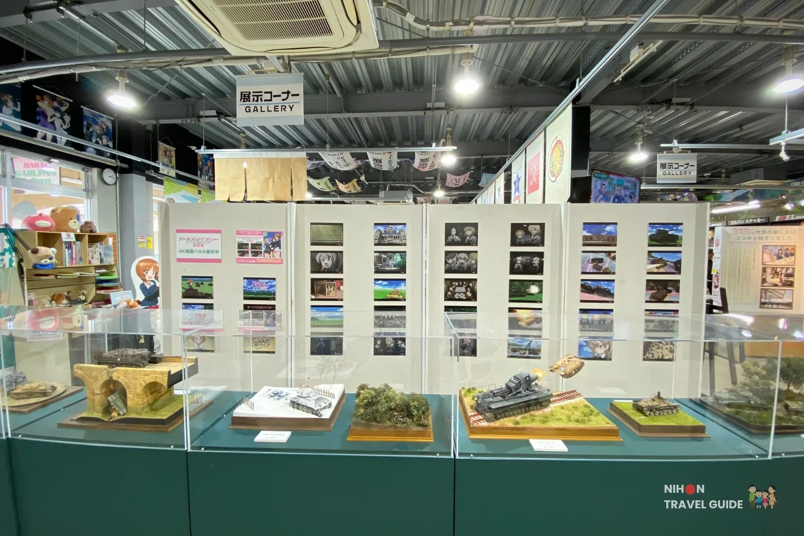 Detailed tank battle dioramas and models on display at Oarai Garupan Gallery.