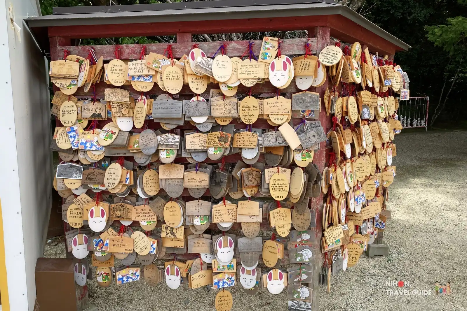 Colorful wooden ema votive plaques covered in wishes hanging at Oarai Isosaki Shrine in Ibaraki, Japan