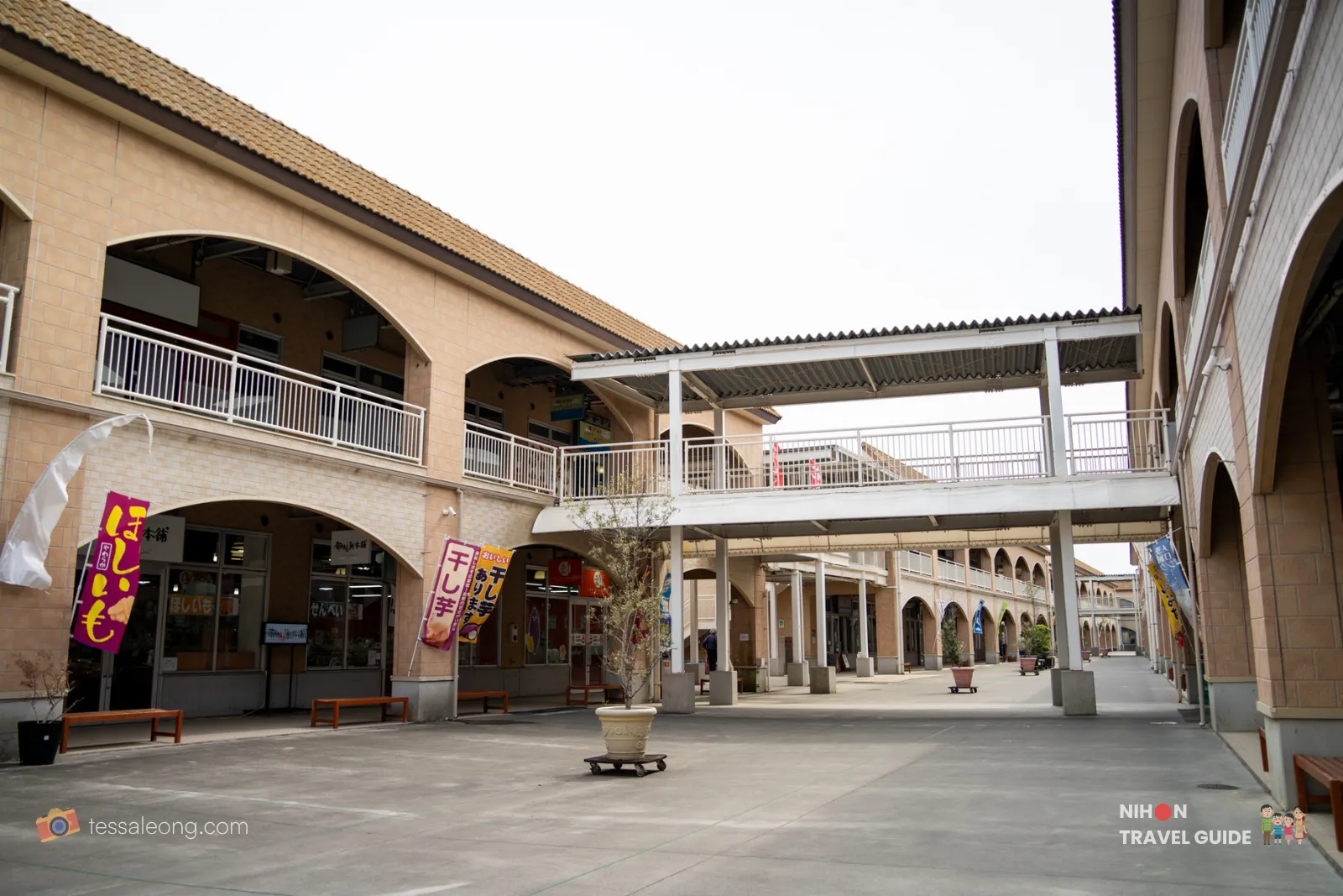 Covered walkway and courtyard at Oarai Seaside Station with shops and second-floor balcony in Ibaraki Japan