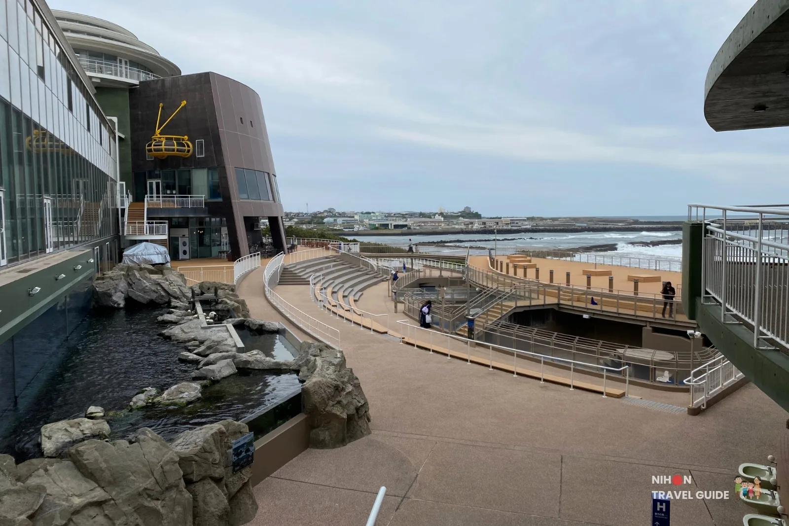 Outdoor amphitheater and viewing area of the Wonderful Sea zone at Aqua World Ibaraki Oarai Aquarium overlooking the Pacific Ocean.