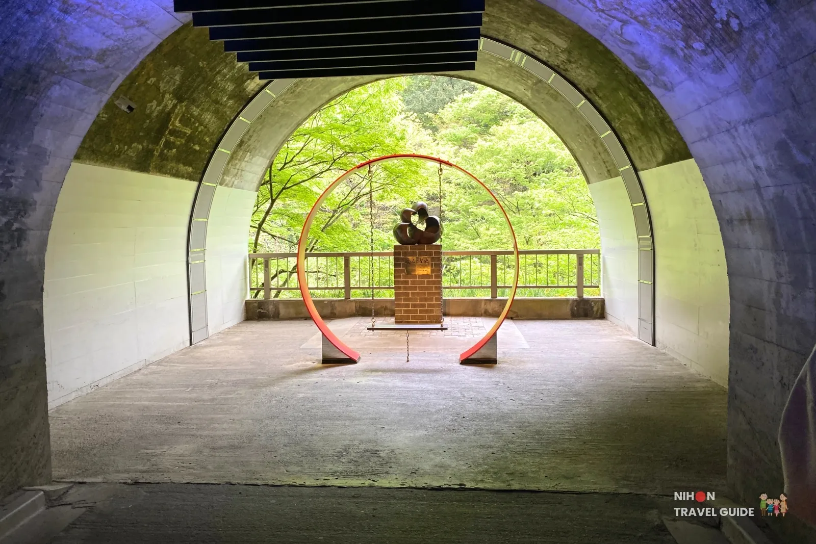 fukuroda-falls-lovers-sanctuary-monument-tunnel Lover’s Sanctuary monument with mandarin duck sculpture and red photo frame swing inside the observation tunnel at Fukuroda Falls