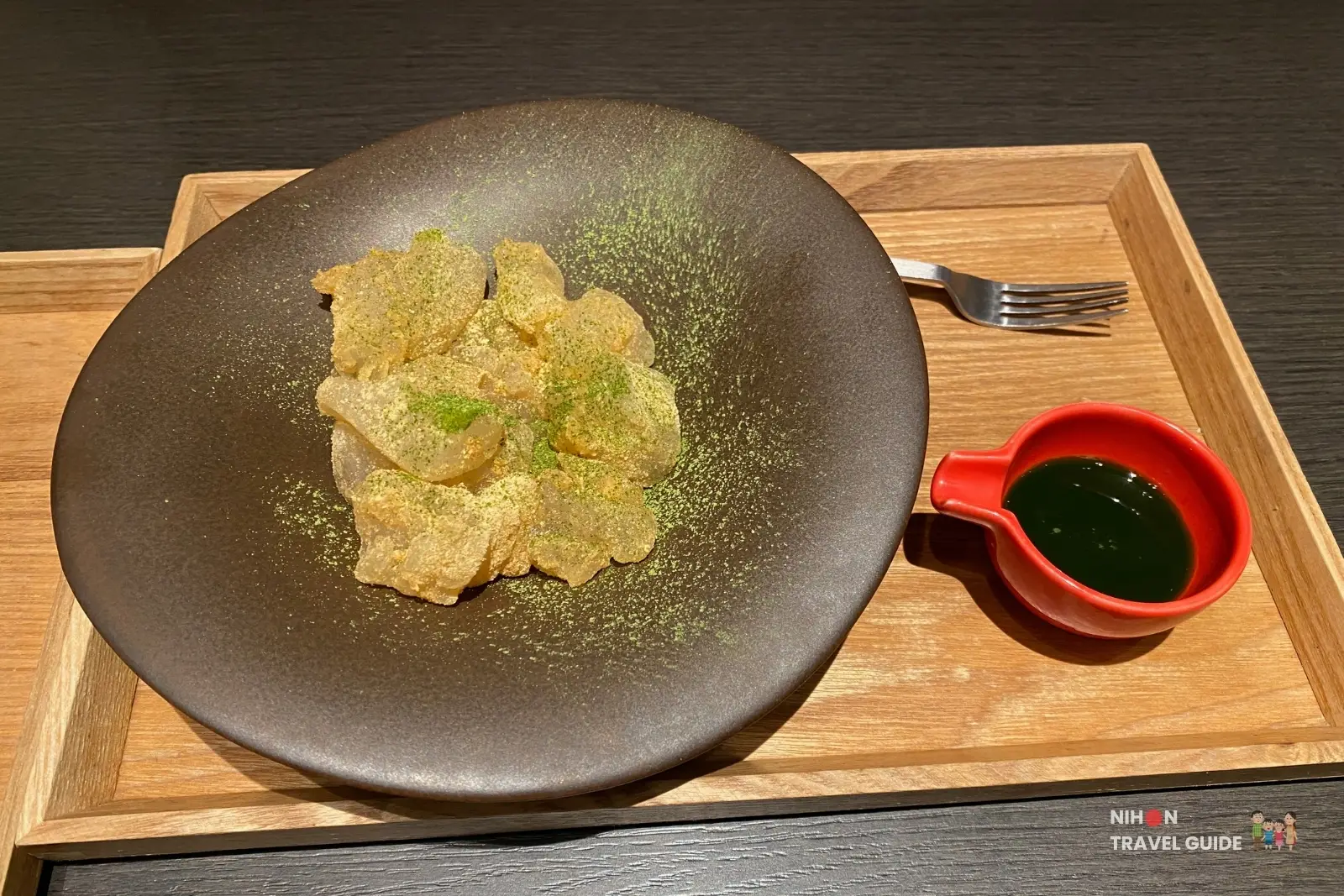 Matcha-dusted warabi mochi with green dipping sauce at CHASEN Cafe, a Kyoto matcha specialty shop on the 3rd floor of Sakura Machi Kumamoto.