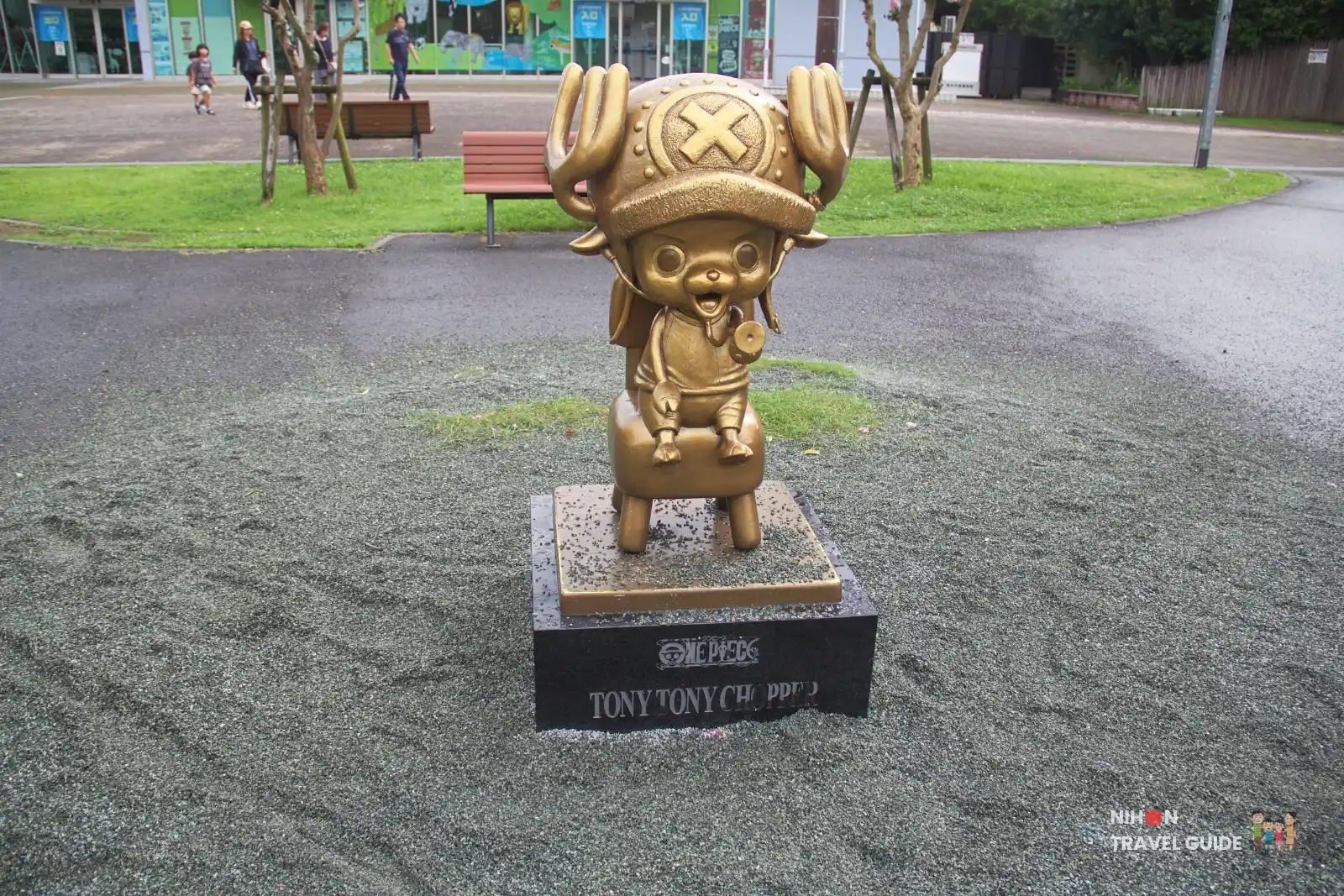 Bronze Tony Tony Chopper statue from One Piece standing in front of Kumamoto City Zoo and Botanical Garden entrance.