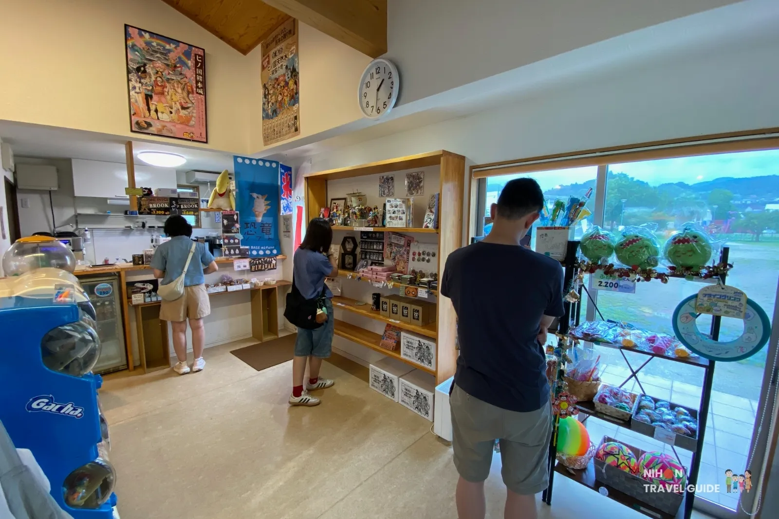 Interior of the Dino Base Mifune souvenir shop selling Brook One Piece figurines and dinosaur-themed goods in Kumamoto.
