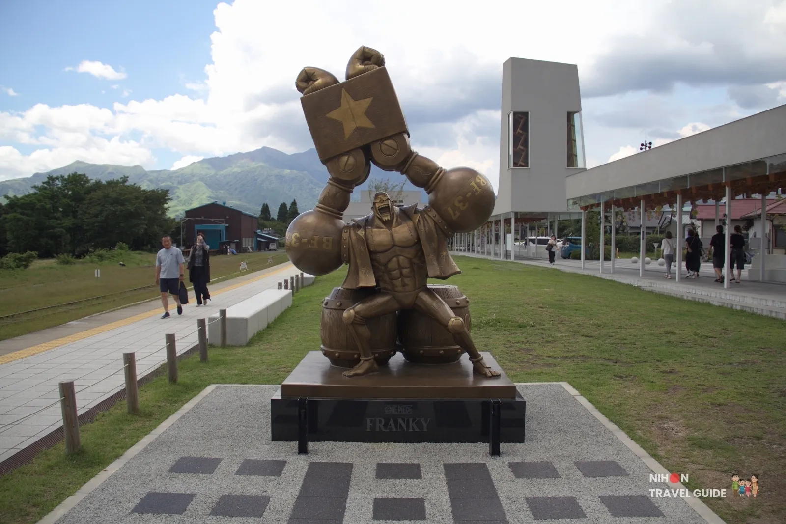 Full front view of the bronze Franky statue from One Piece at Takamori Station in the Aso region of Kumamoto.