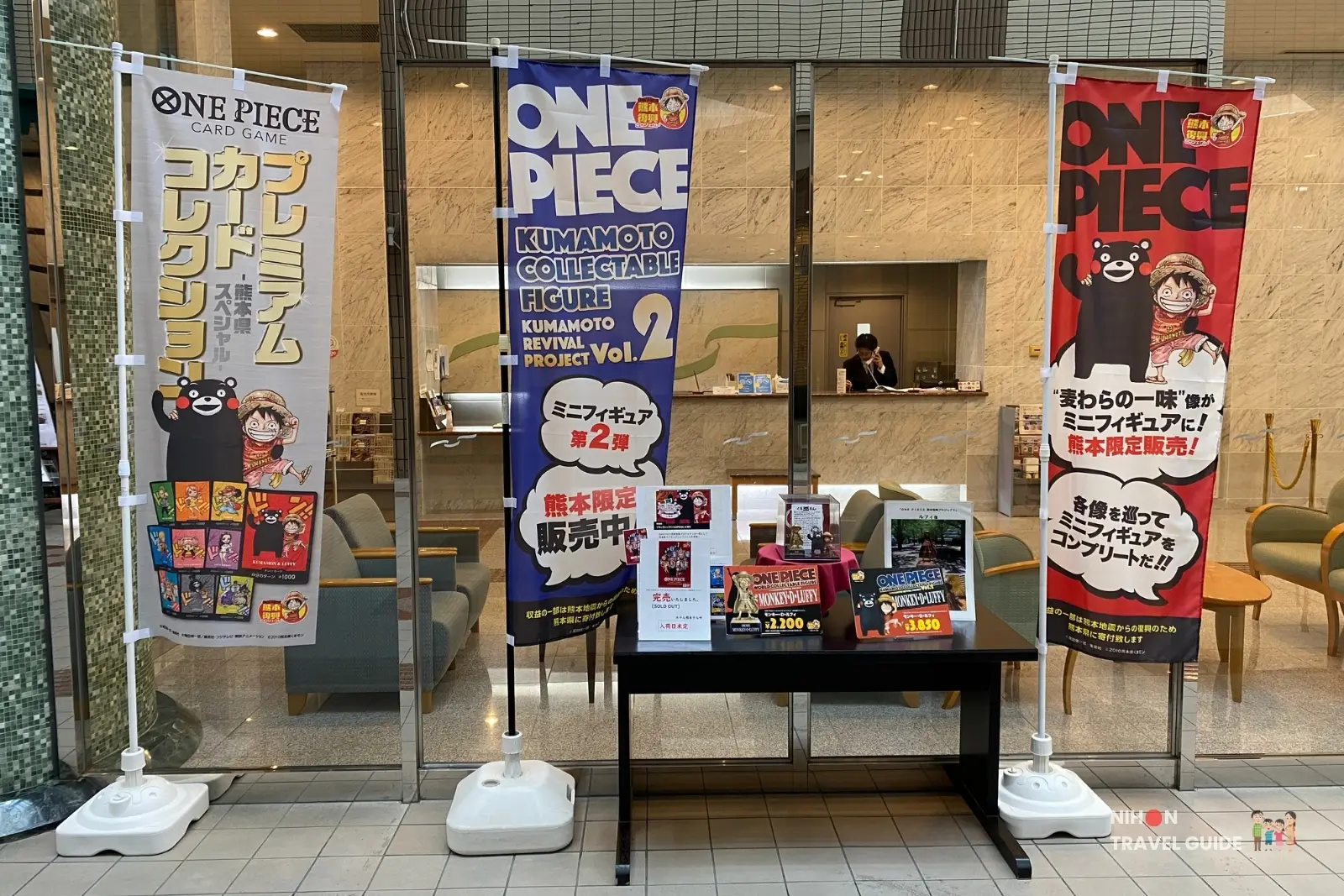 Hotel Kumamoto Terrsa lobby display selling limited edition Luffy One Piece figurines from the Kumamoto Revival Project.