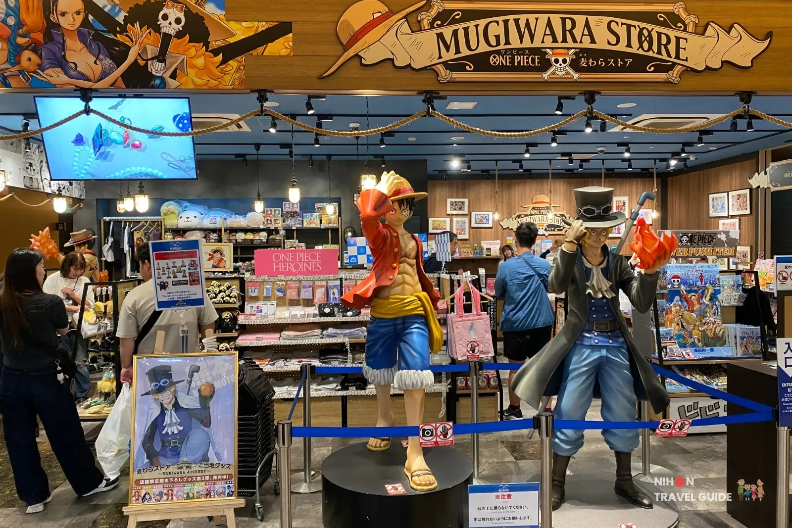 Entrance of ONE PIECE Mugiwara Store Kumamoto in Amu Plaza with life-size Luffy and Sabo figures.