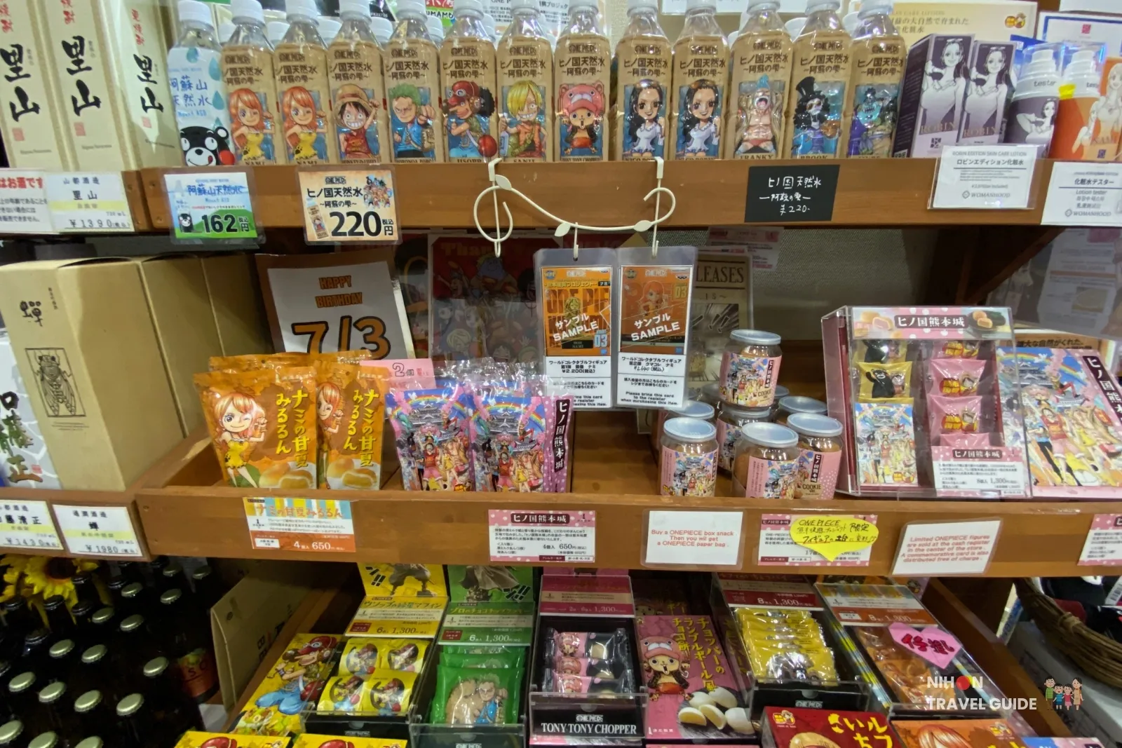 Interior of the souvenir shop at Moe no Sato selling Nami One Piece figurines, character drinks, and local Kumamoto products.