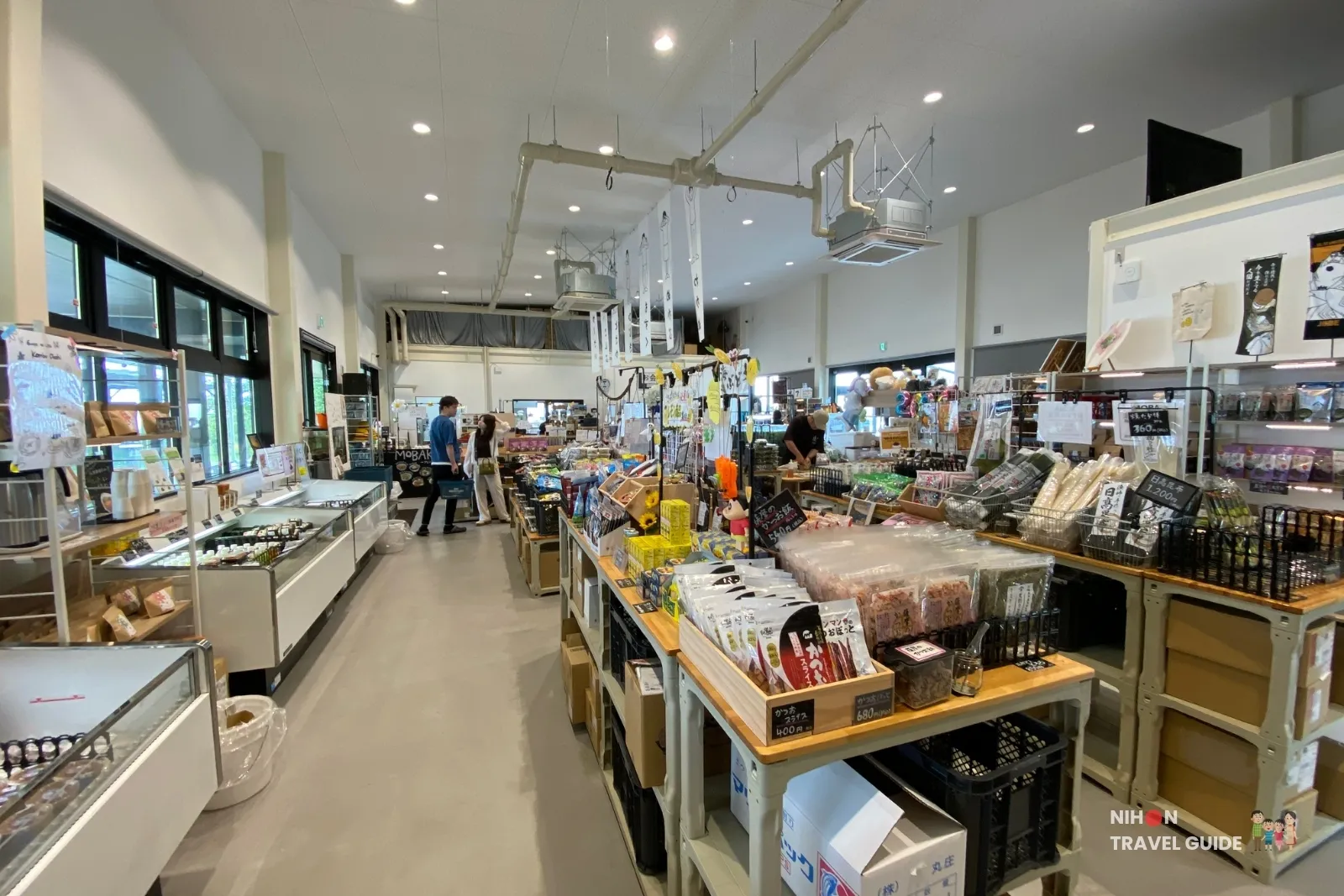 Interior of OKAGESAMA MOBA at Sumiyoshi Seaside Park showing local products and One Piece merchandise in Kumamoto