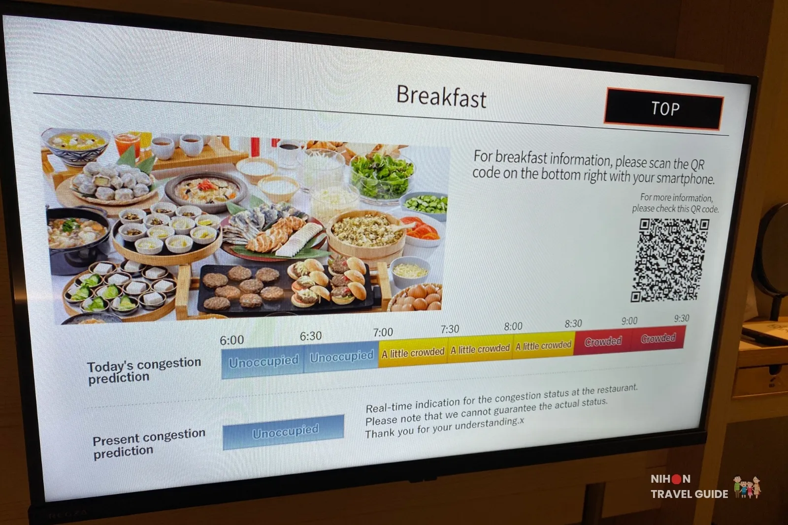 In-room television at REF Kumamoto by Vessel Hotels showing breakfast menu photos, today’s congestion prediction timeline from 6:00 to 9:30, and real-time restaurant occupancy status
