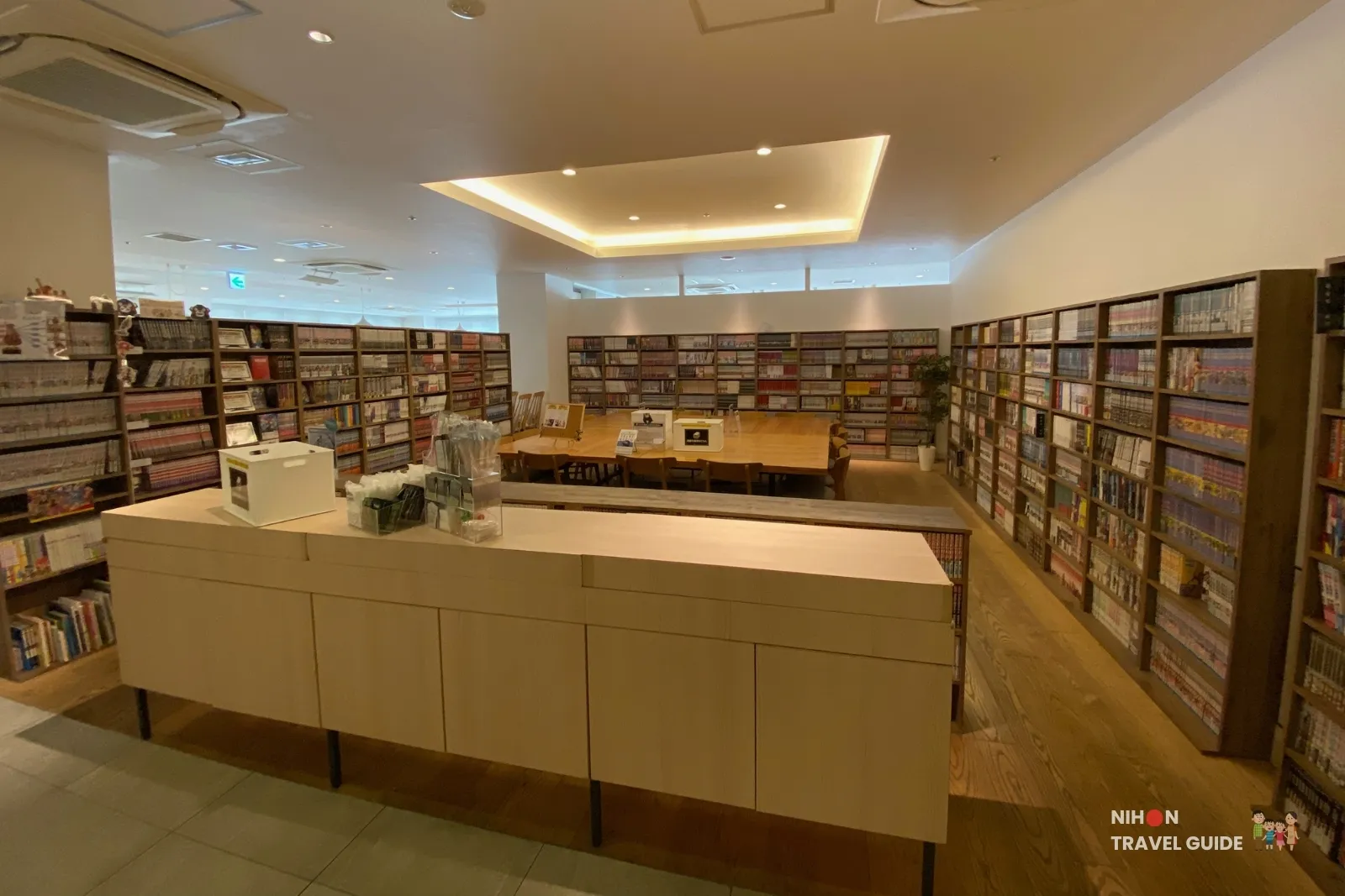 Manga library at REF Kumamoto by Vessel Hotels featuring around 10,000 comics, wooden bookshelves, reading tables and a bright modern lounge area free for hotel guests