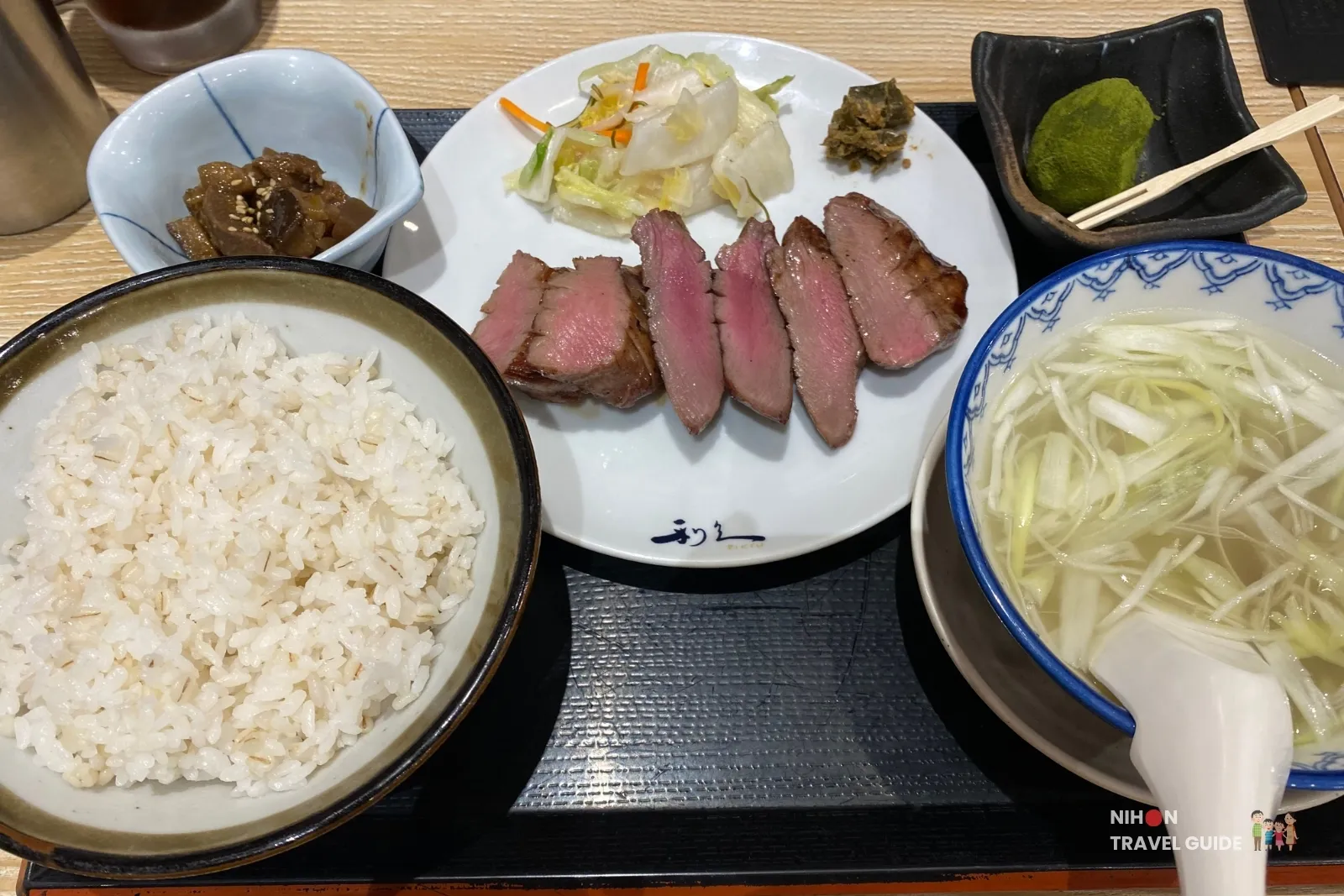 Thick-cut charcoal-grilled beef tongue set meal at Gyutan Sumiyaki Rikyu on the 3rd floor of Sakura Machi Kumamoto, served with rice, tail soup, pickles, and wasabi.