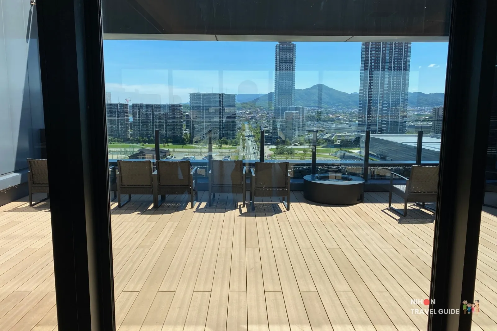 11th floor sky terrace at The358 SORA looking out over Island City high-rises and the mountains beyond
