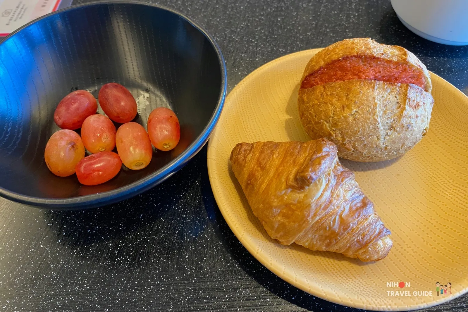 Croissant, bread roll and grapes from the breakfast buffet at 空-KU in The358 SORA Fukuoka.