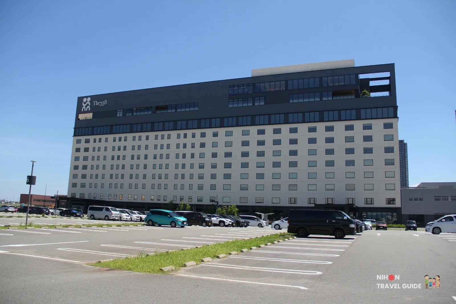 The358 SORA and UMI hotel building on Fukuoka Island City, seen from the Island Eye car park on a clear day.