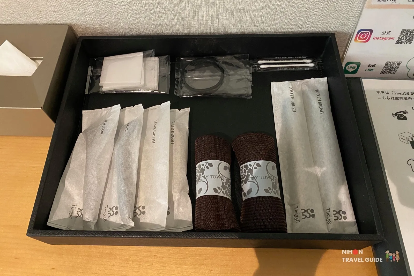 Complimentary amenities in The358 SORA room including toothbrush, razor, hairbrush, cotton and body towels