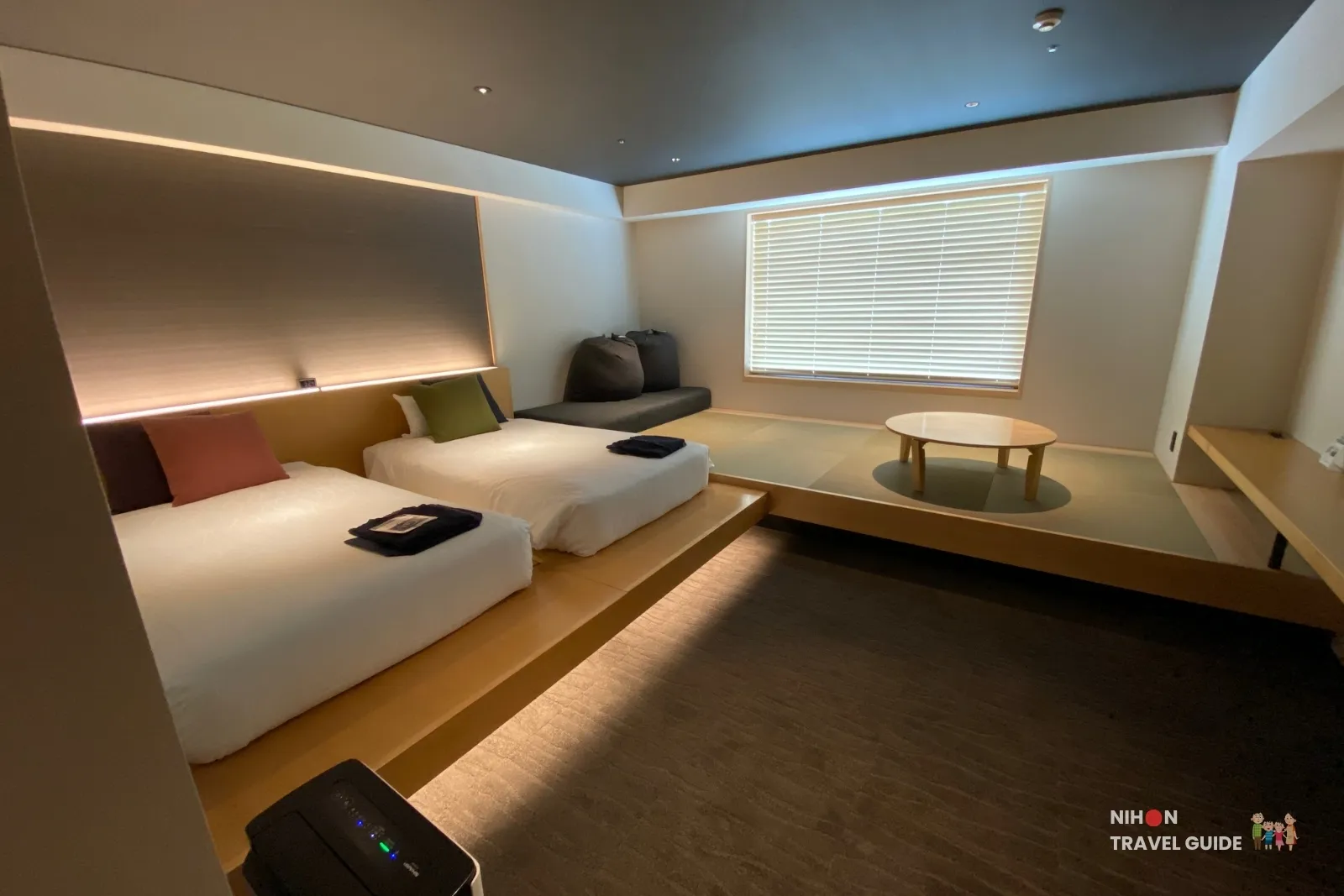 Full view of The358 SORA Modern Japanese Premium Room showing twin beds, tatami space, low table and air purifier