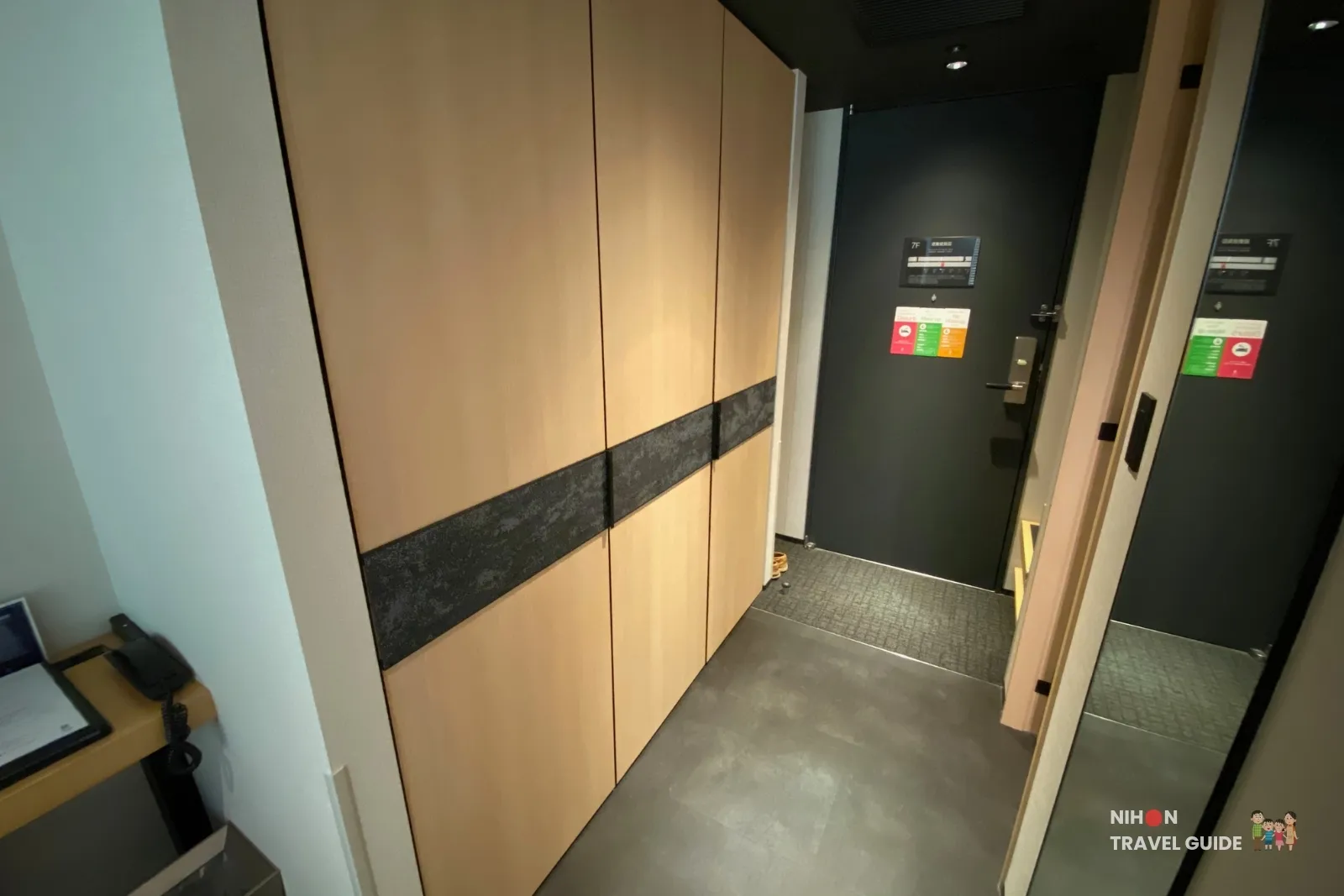Entrance of The358 SORA Modern Japanese Premium Room with built-in wardrobe and housekeeping door hangers.