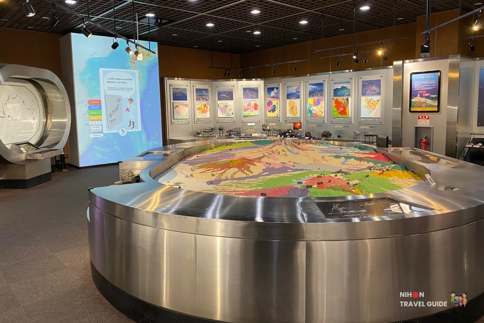 Wide interior view of Exhibition Room 3 showing the large interactive 3D topographic model of Mt. Fuji and surrounding volcanic areas at the Tsukuba Geological Museum.