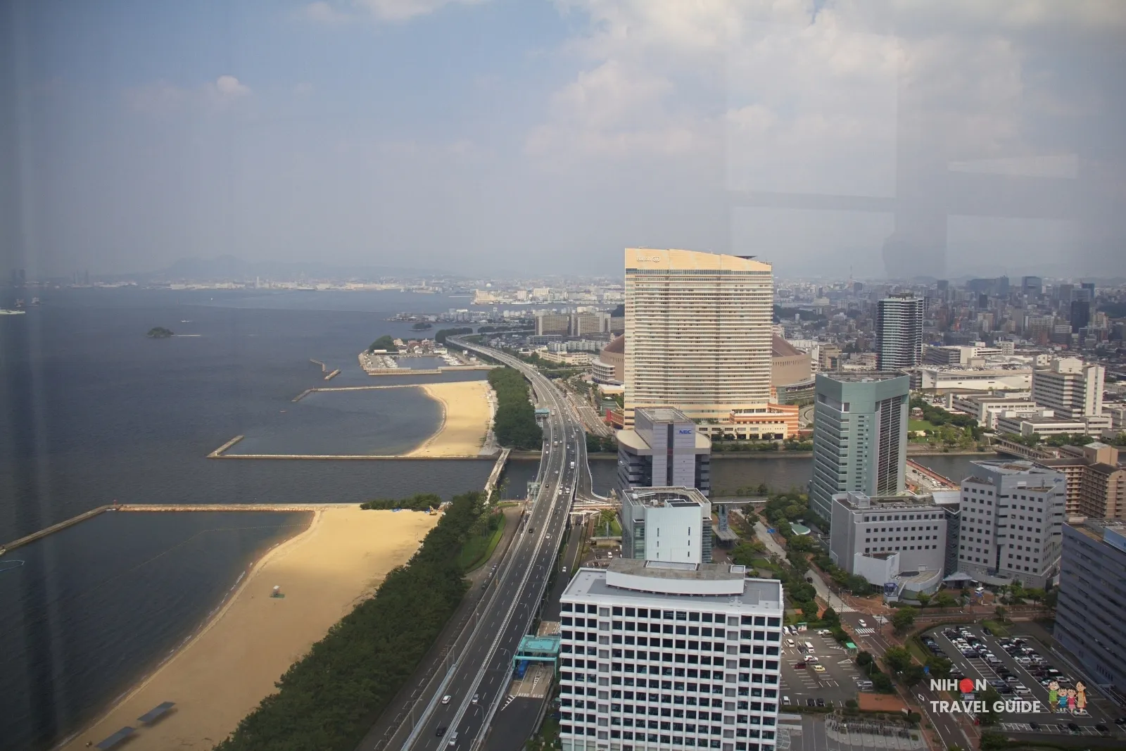 View from Fukuoka Tower east along Hakata Bay and Momochi beach toward Hilton Fukuoka Sea Hawk and PayPay Dome.