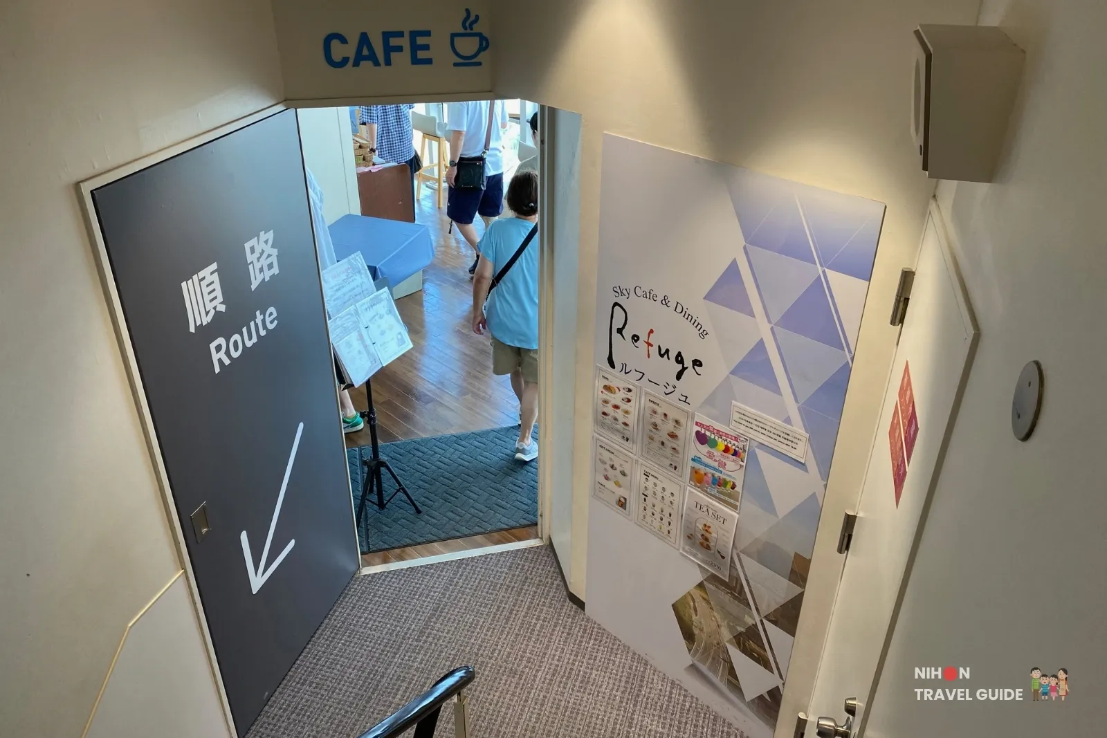 Entrance to Sky Cafe & Dining Refuge on Fukuoka Tower observation 2F, marked Cafe with a one-way route sign.